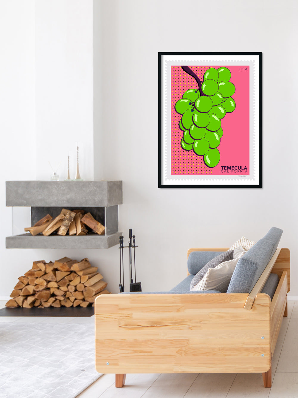 Living room with a wooden sofa, fireplace, and a colorful abstract art print on the wall.