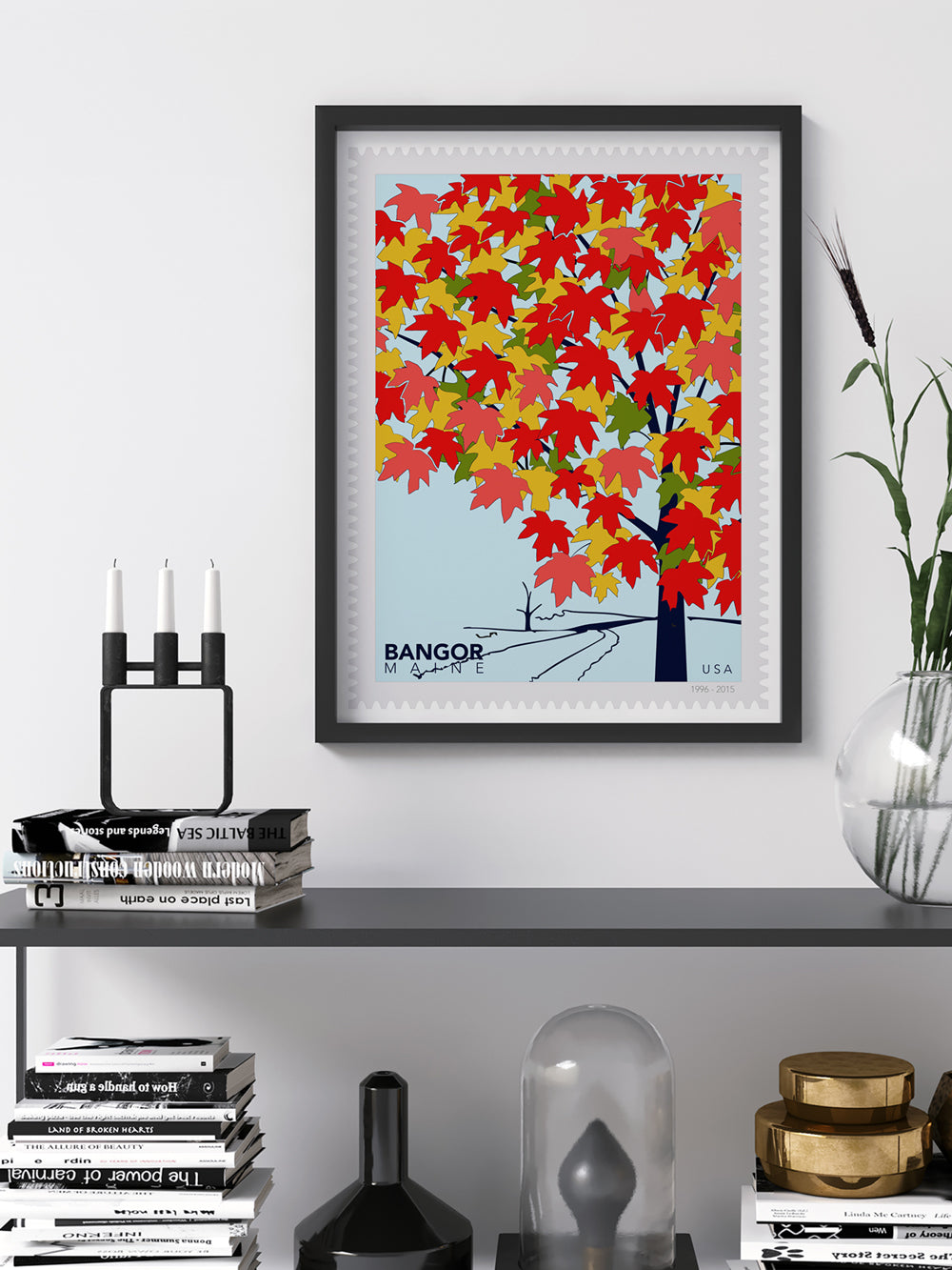 Framed art of a stylized postage stamp with a colorful tree and 'Bangor, Maine, USA' text on a white background